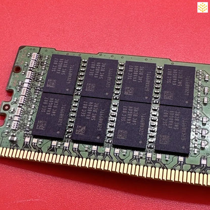 RAM memory module with visible memory chips mounted on a green circuit board.