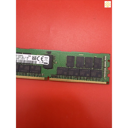 Computer RAM stick with visible circuit board and memory chips.