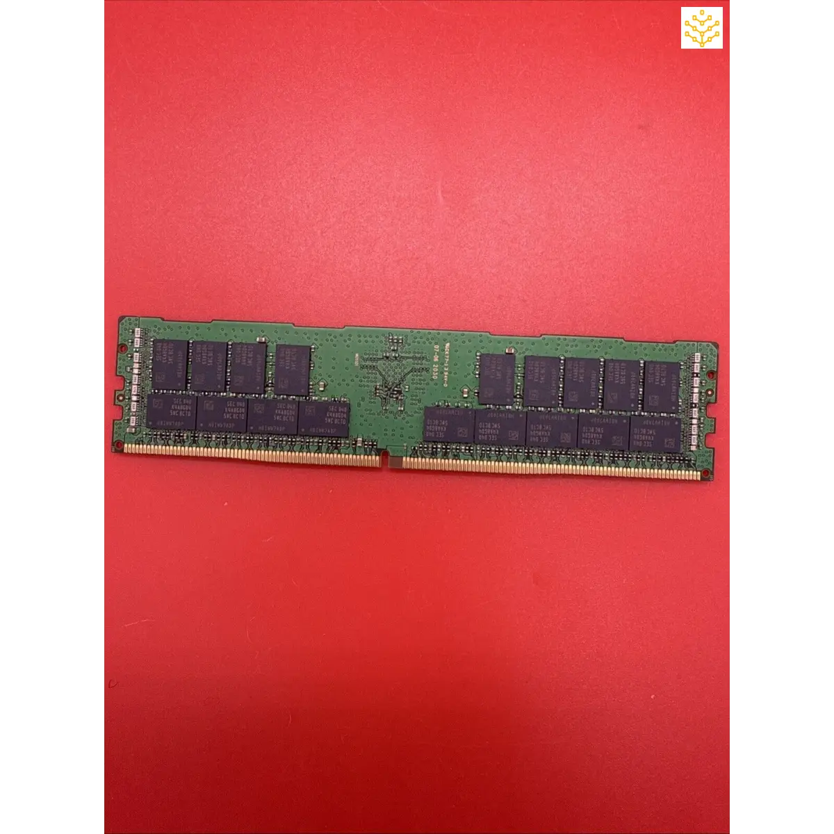 Computer RAM stick with black memory chips on a green circuit board.