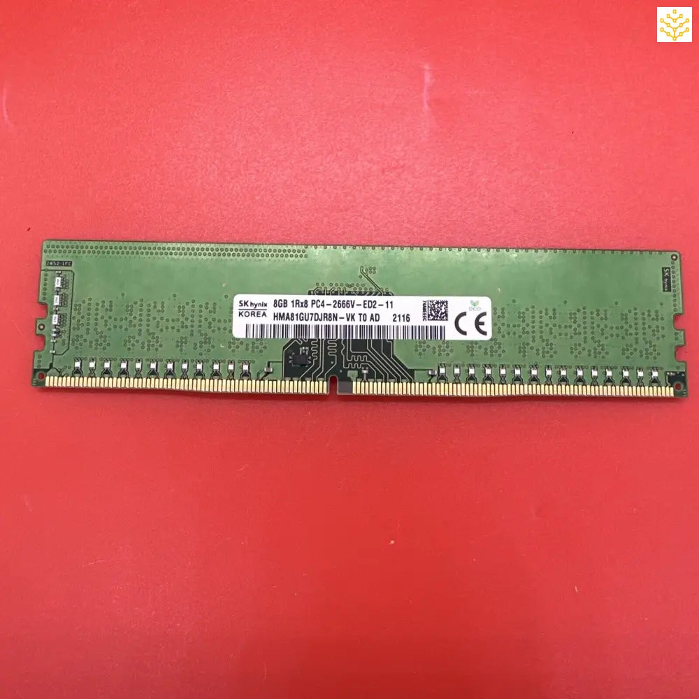 Computer RAM stick with a green circuit board.