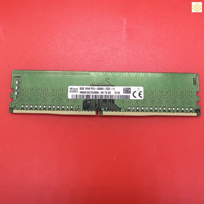 Computer RAM stick with a green circuit board.