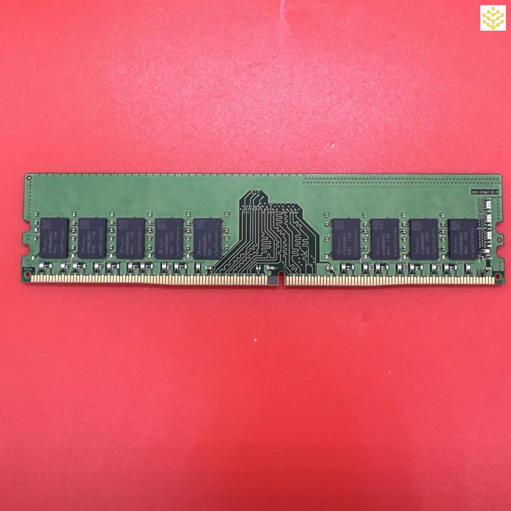 Computer RAM stick with black memory chips on a green circuit board.