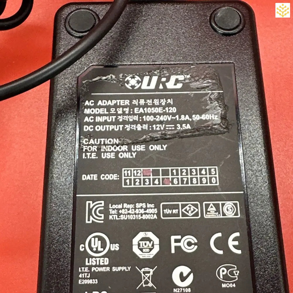 Power adapter or AC/DC converter with technical specifications and safety certifications printed on its label.