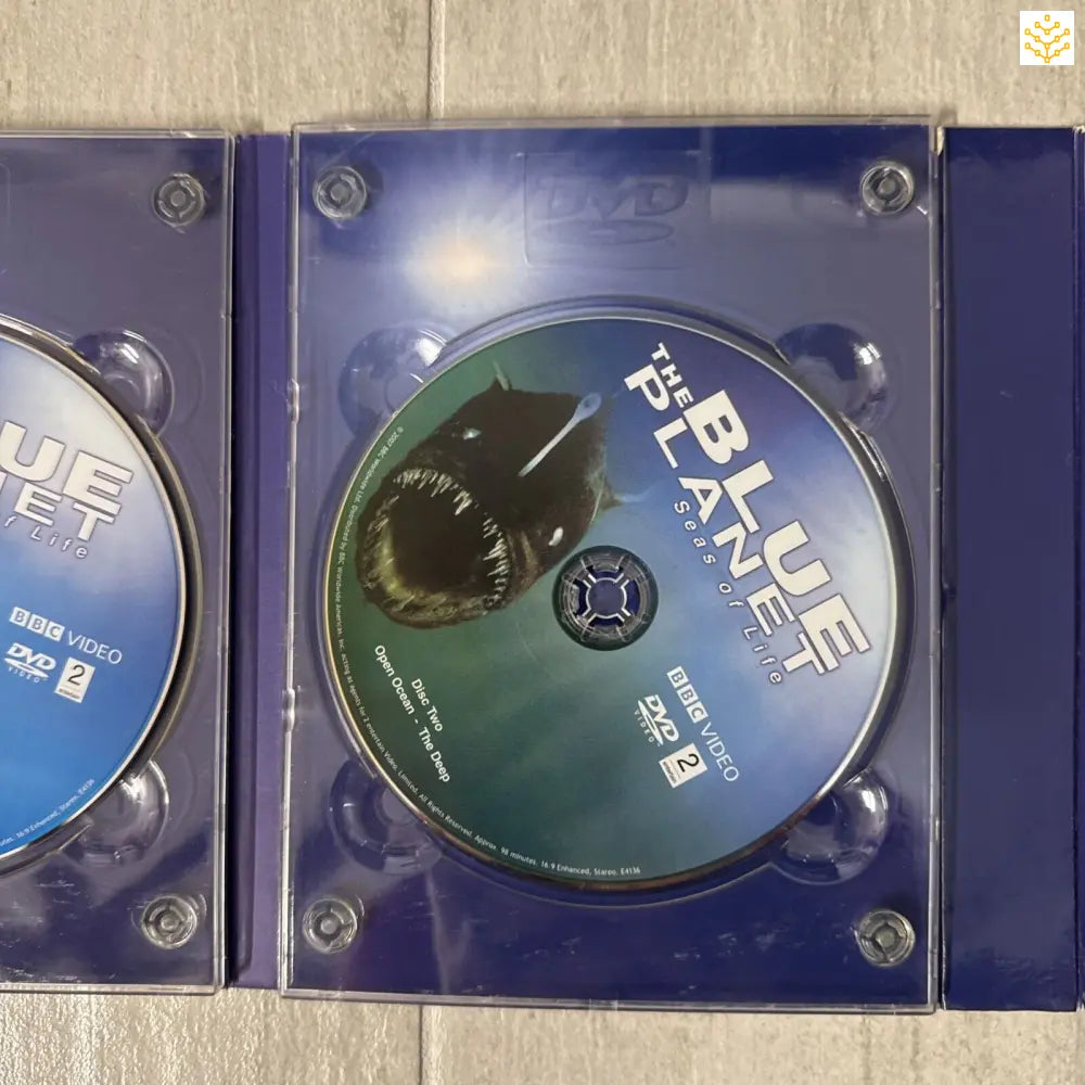 DVD disc in a blue plastic case showing ’Blue Planet’ text.