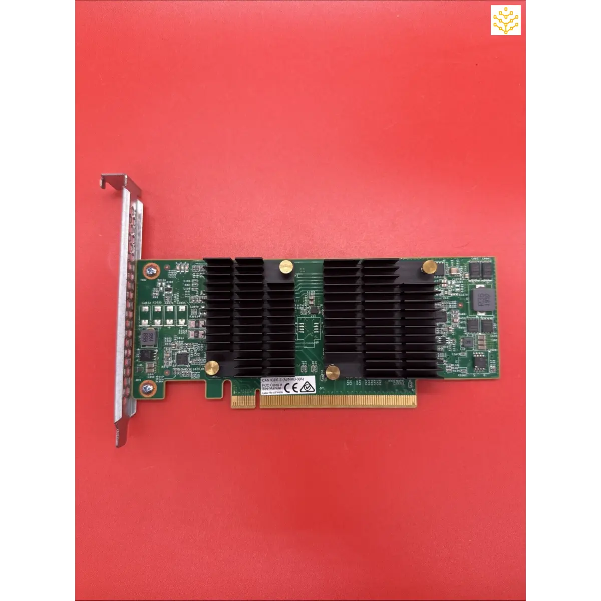 Computer graphics card with a black heat sink and green circuit board.