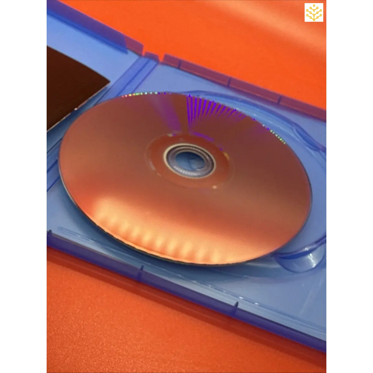 Compact disc (CD) inside a blue plastic case.