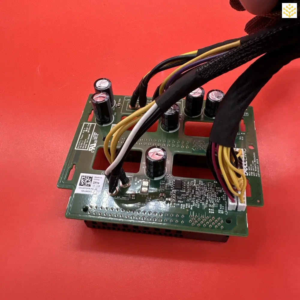 Circuit board with various electronic components and wires attached.