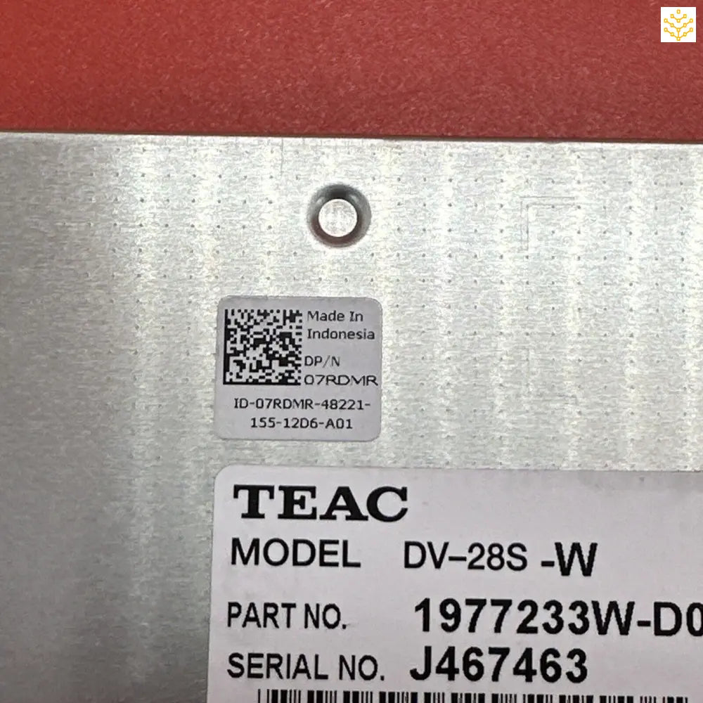 Electronic device component labeled with TEAC model and serial number information.