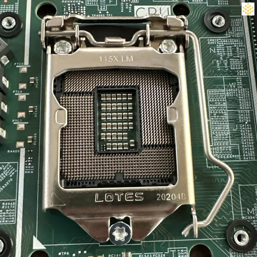 CPU socket on a motherboard with a metal retention bracket and pins visible.