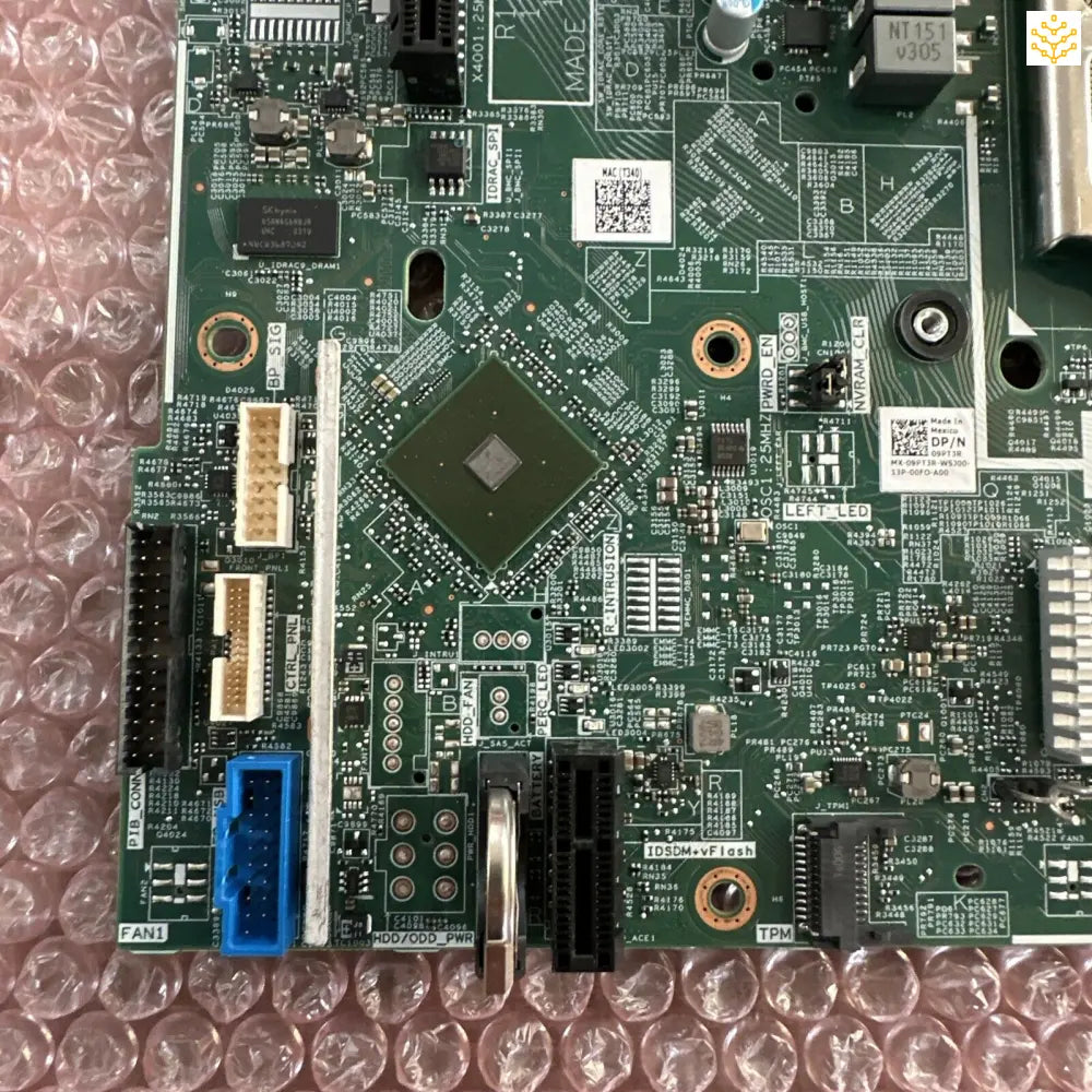 Computer motherboard with various electronic components and connectors.