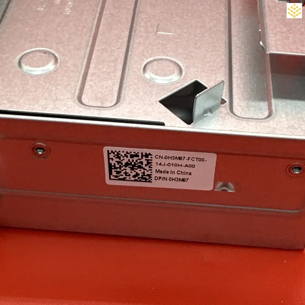 Metal electronic component or module with a QR code label and mounting holes.