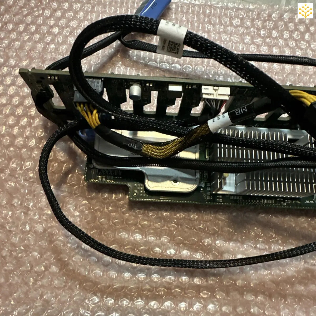 Graphics card with attached cables and cooling components.