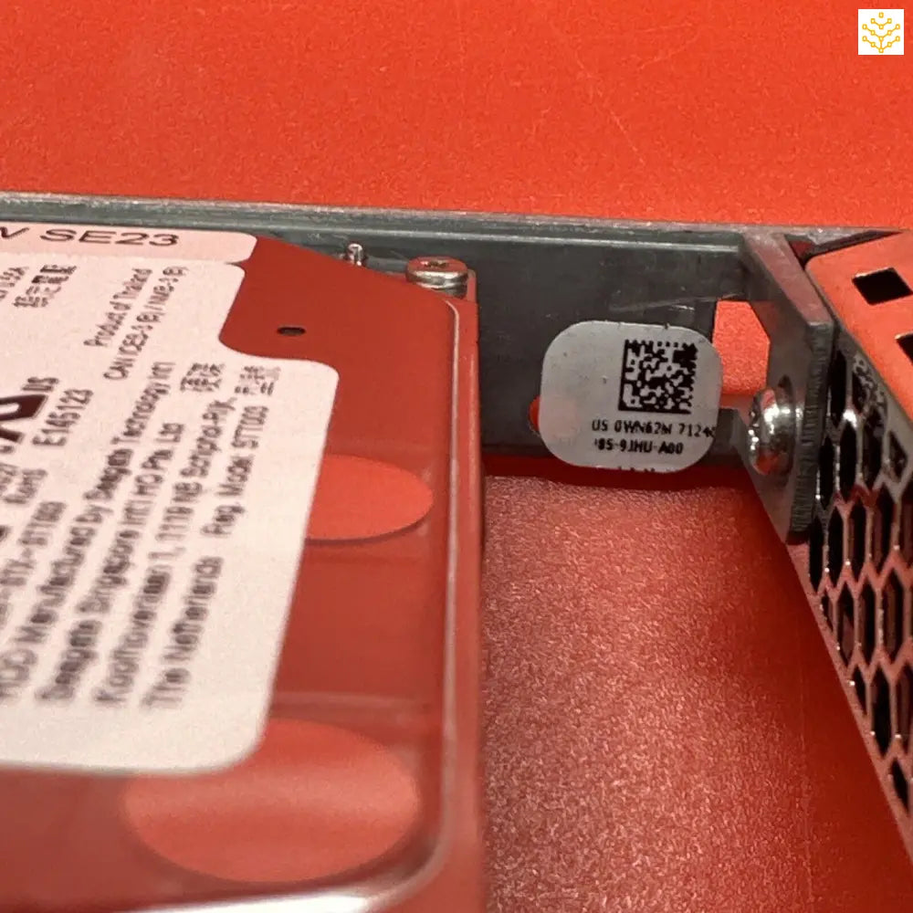 Hard drive or storage device with a red plastic casing and visible label.