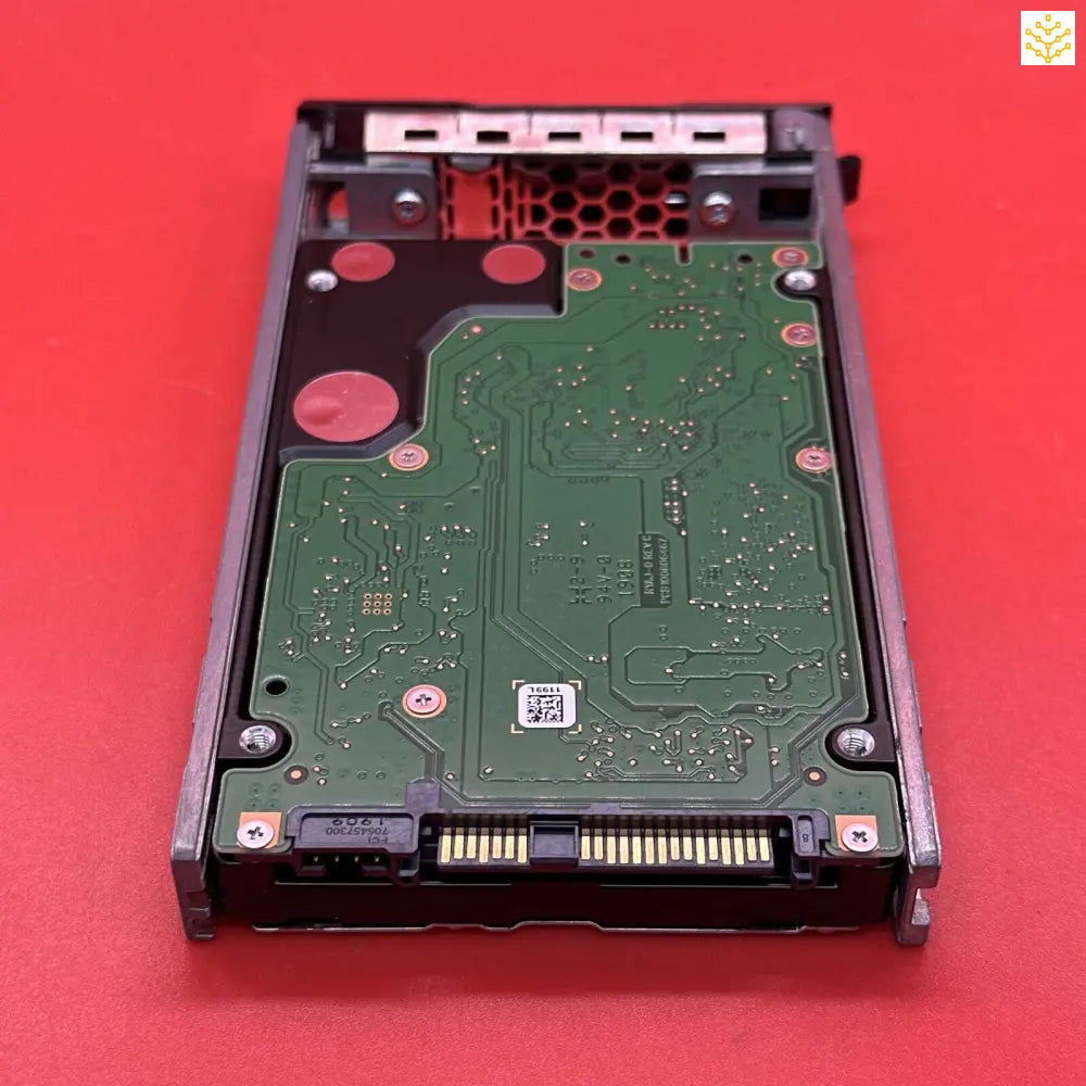 Hard drive or solid-state drive (SSD) with its circuit board exposed.