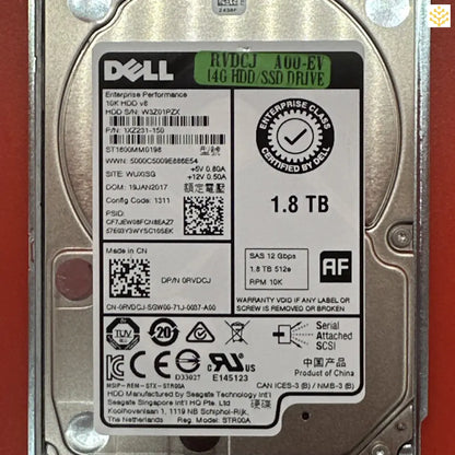 Dell 1.8 TB hard disk drive with various technical specifications and certifications visible on its label.