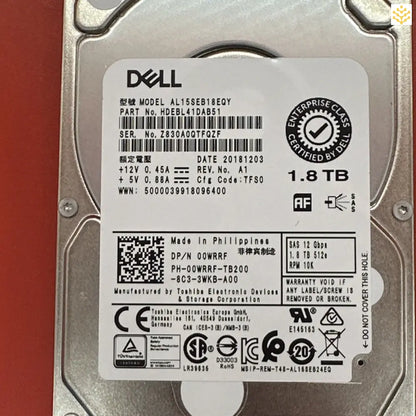 Dell 1.8TB hard disk drive with various technical specifications and certification labels visible.