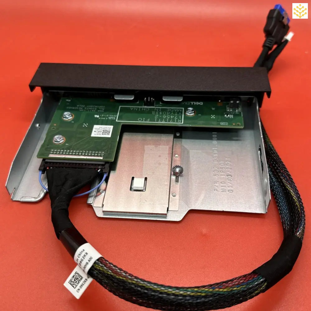 Computer hardware component with circuit boards and cables, likely an internal drive or expansion card.