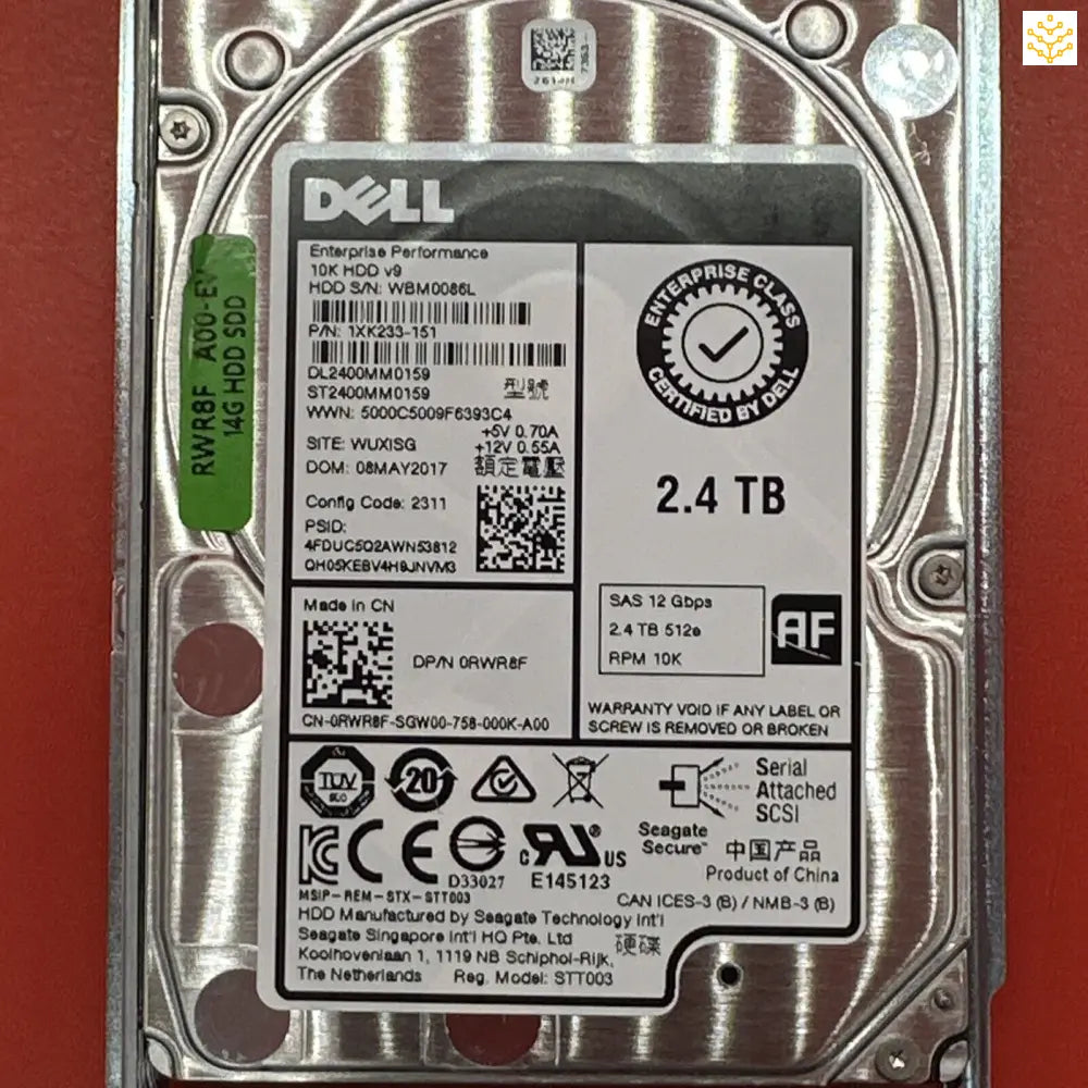 Dell 2.4 TB hard disk drive with detailed product information label.