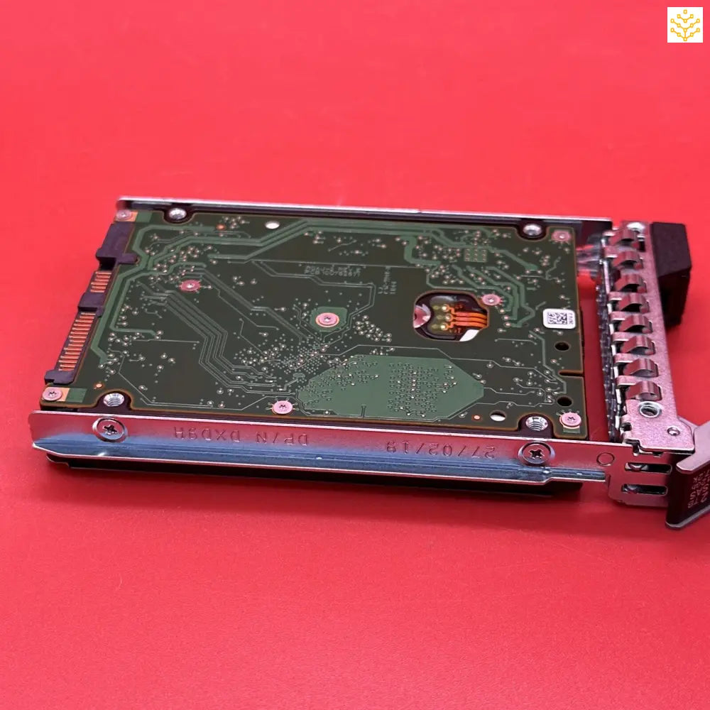 Hard drive or storage device with exposed circuit board mounted in a metal frame.