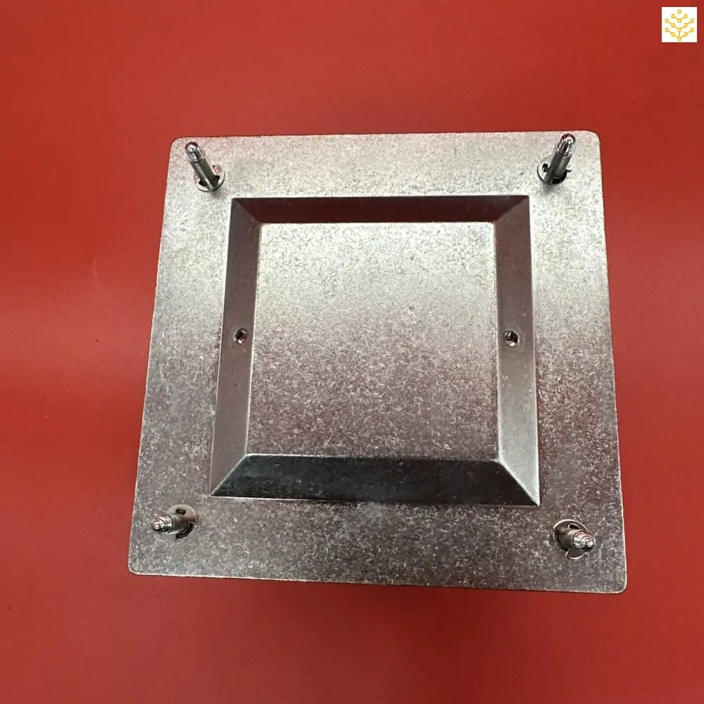 Square metal frame or plate with a central opening and four protruding bolts or screws at the corners.