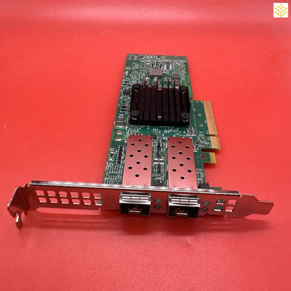 Network interface card with dual ports and a heat sink.