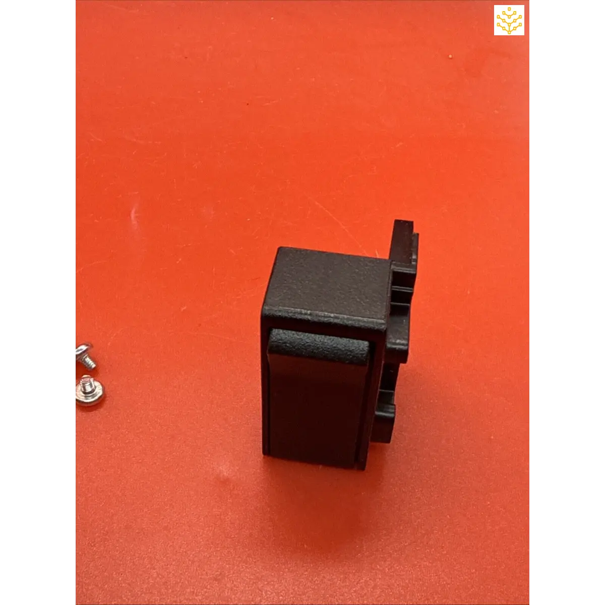 Black plastic electrical outlet or socket.