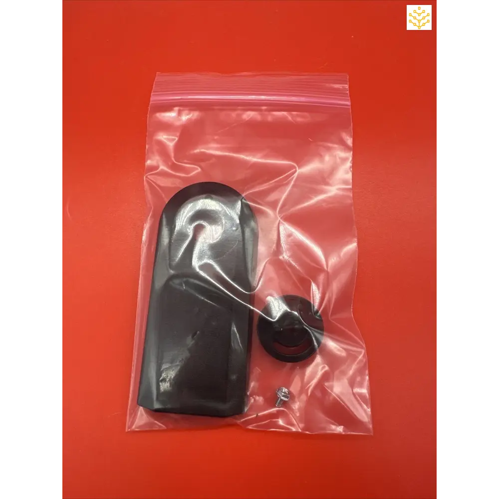 Black plastic door handle sealed in a clear plastic bag.