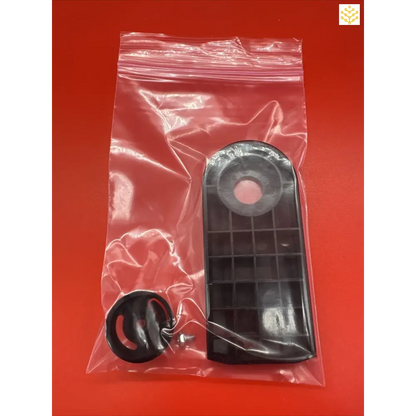 Remote control sealed in a clear plastic bag.