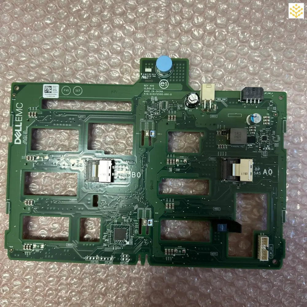 Green circuit board with various electronic components and connectors.