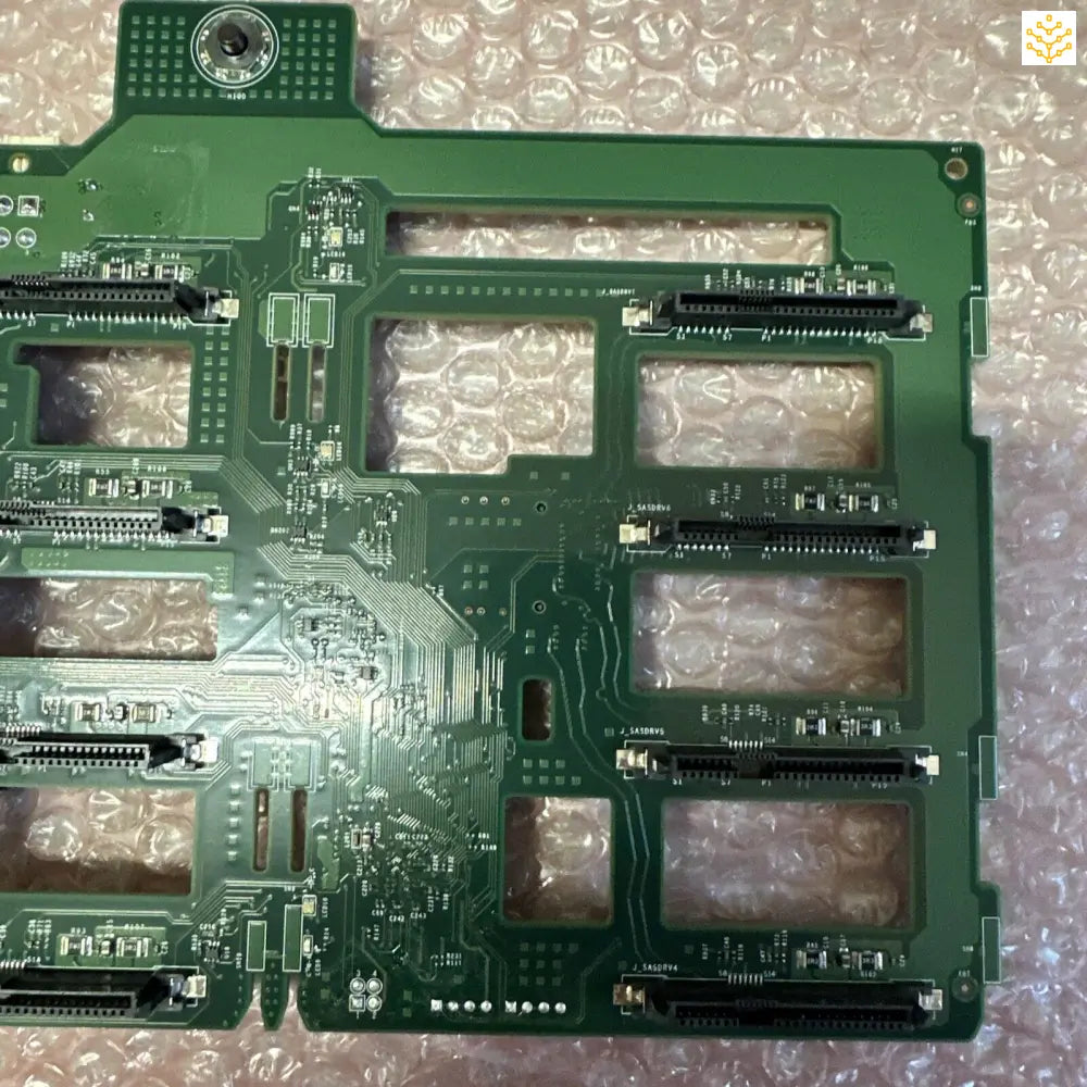 Green printed circuit board with multiple expansion slots and electronic components.