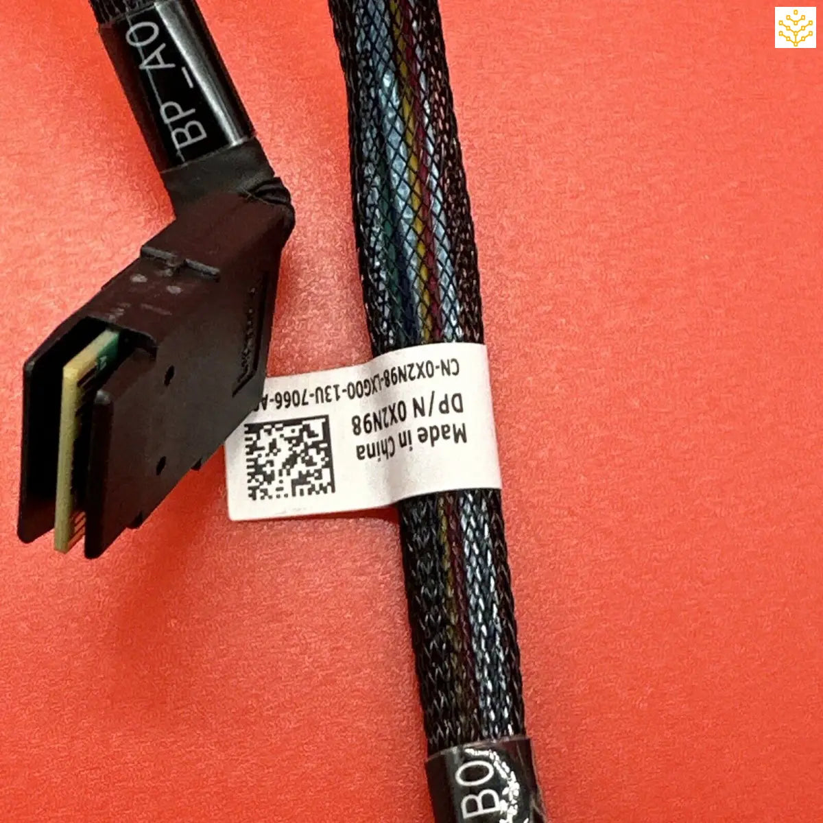 Computer cable or power cord with a connector and label attached.