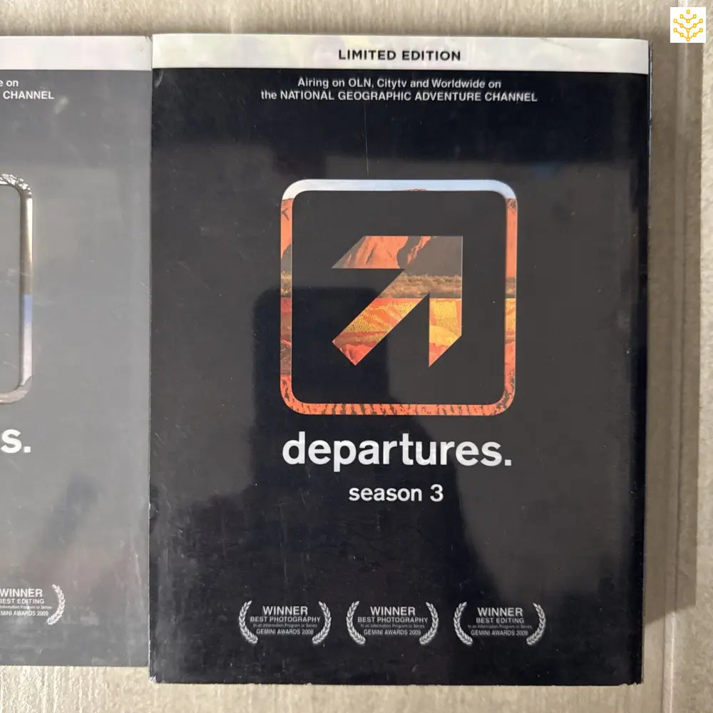 Limited edition DVD/Blu-ray case for ’departures. season 3’’ featuring an orange and black arrow logo.