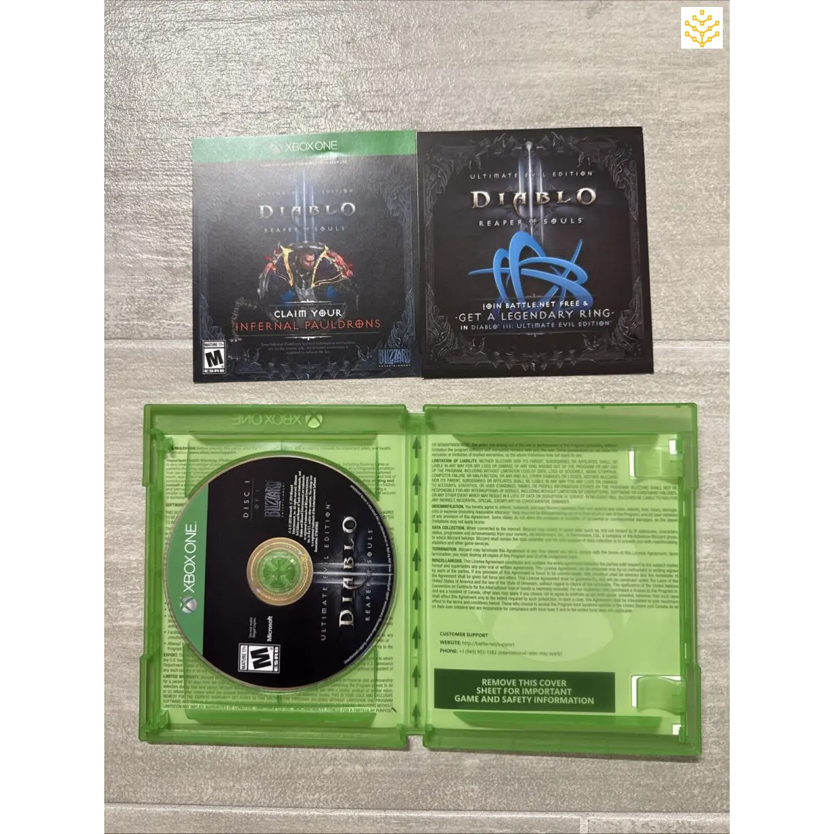 Video game disc and packaging for Diablo IV, including the game case, disc, and promotional materials.