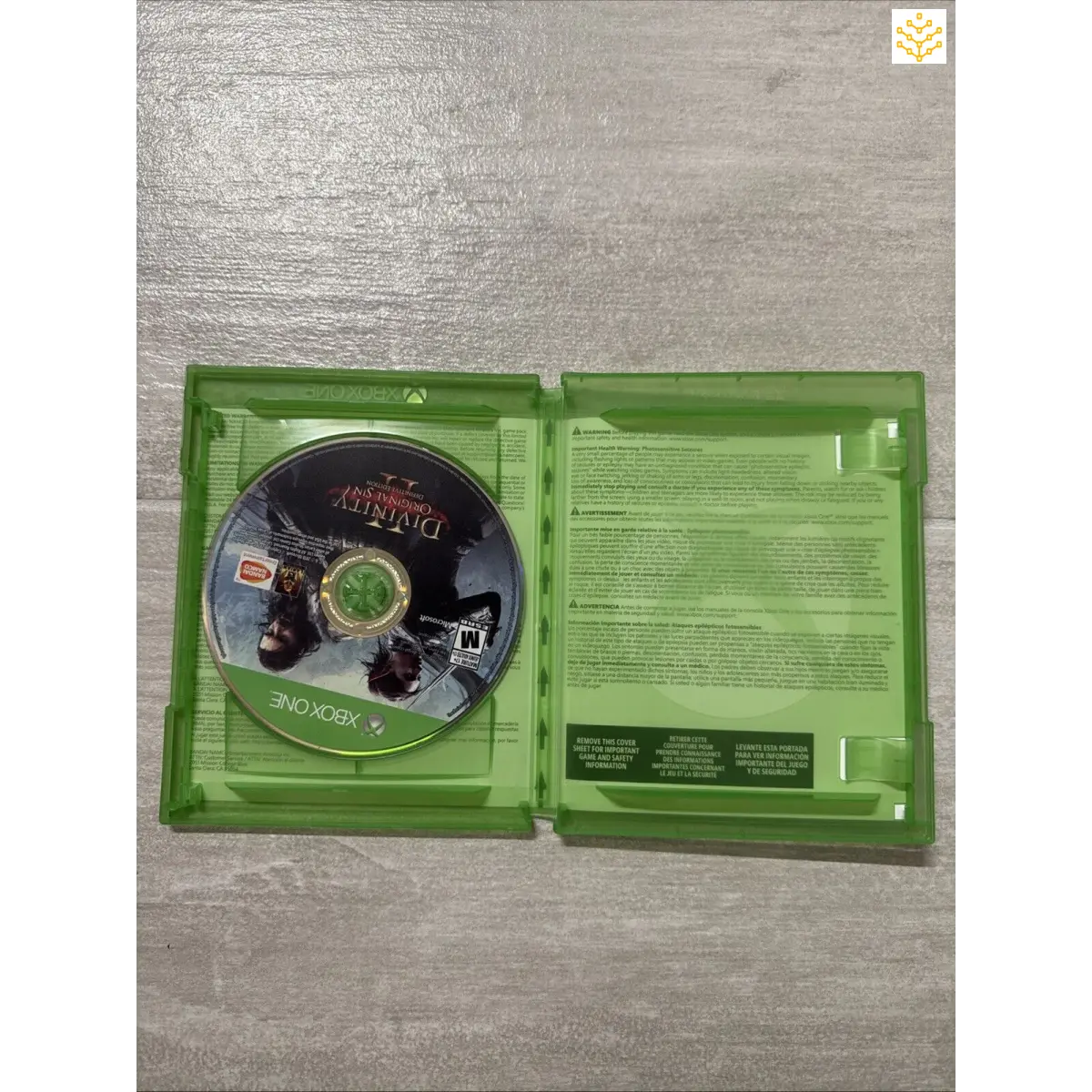 Xbox game disc for ’Medal of Honor: Airborne’ in an open green case.