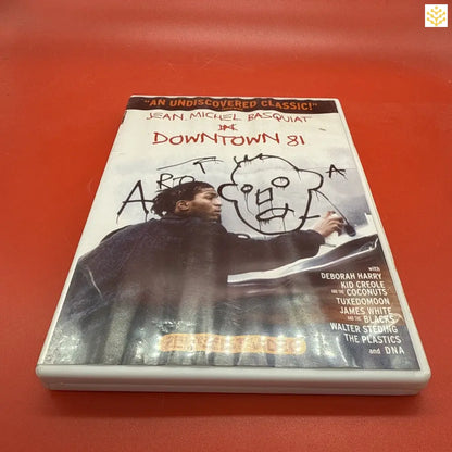 DVD case titled ’Downtown 81’’ with graffiti-style artwork on the cover.