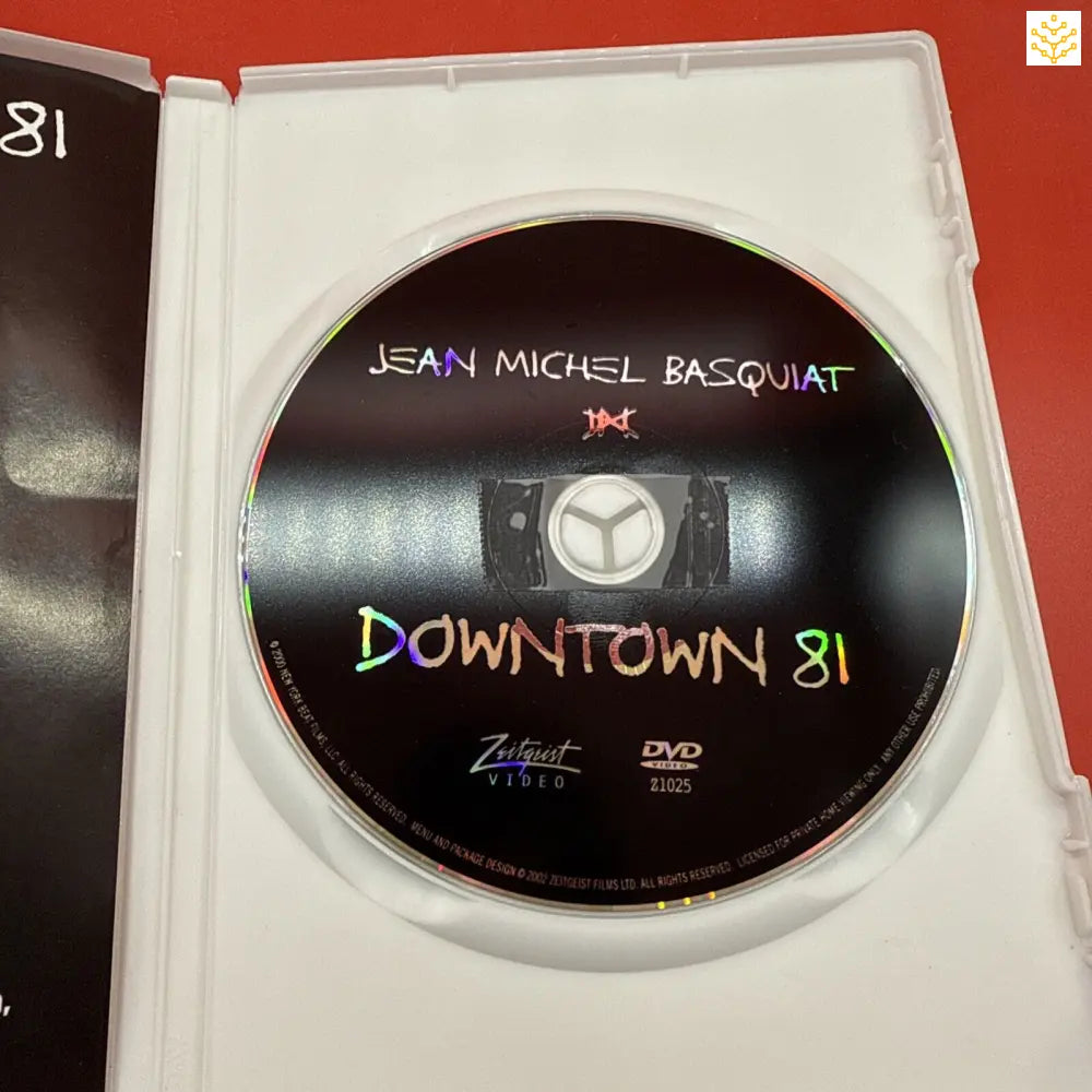 DVD disc labeled ’Downtown 81’’ with Jean Michel Basquiat’s name at the top.