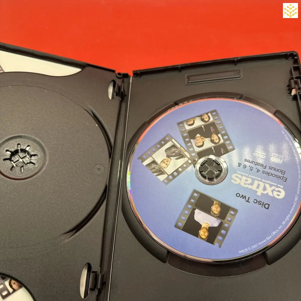 DVD case opened to show a disc inside.