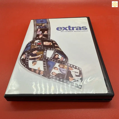 DVD case for the television show ’Extras’ featuring a film strip design on the cover.