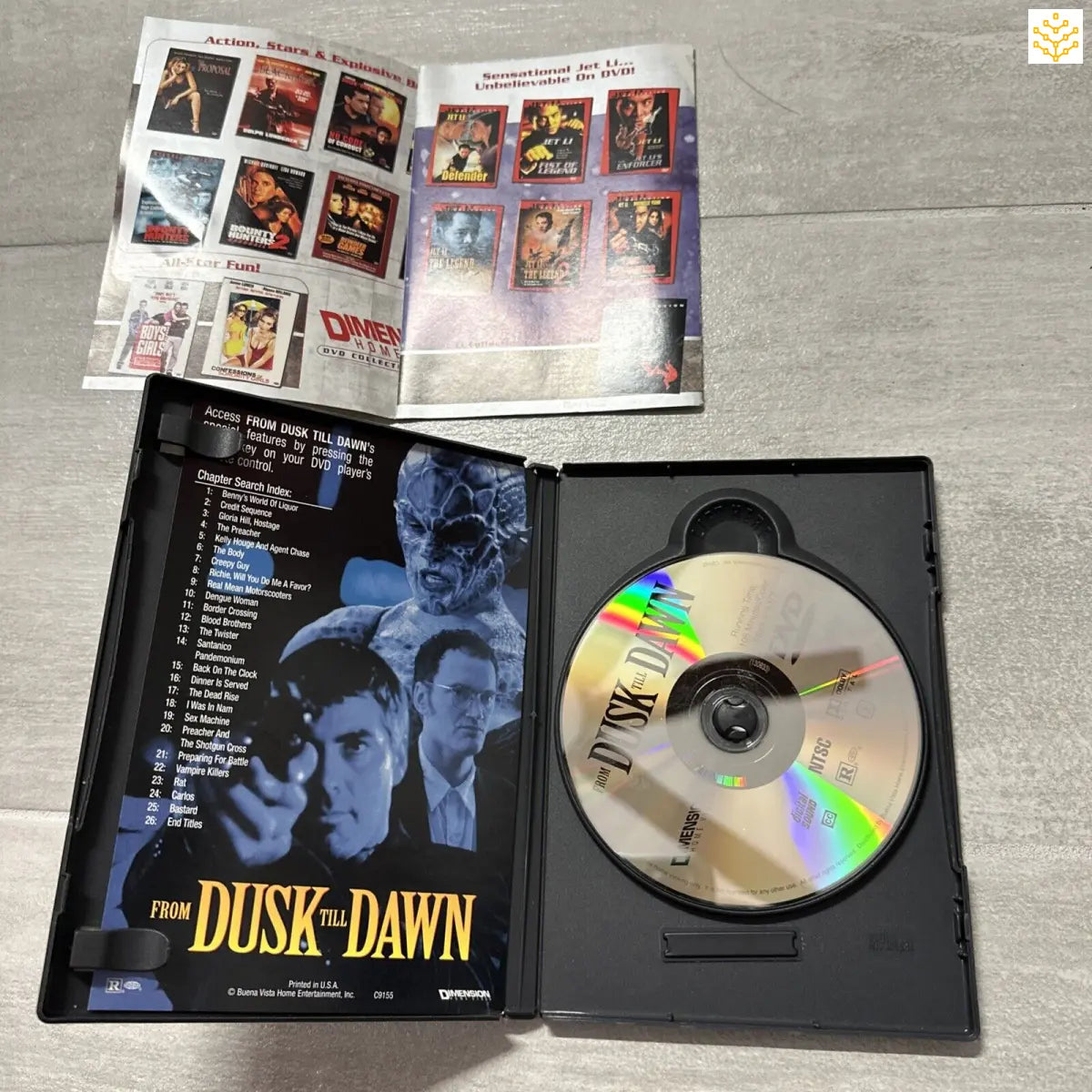 DVD case and disc for the movie ’From Dusk Till Dawn’ alongside a booklet showing movie posters.