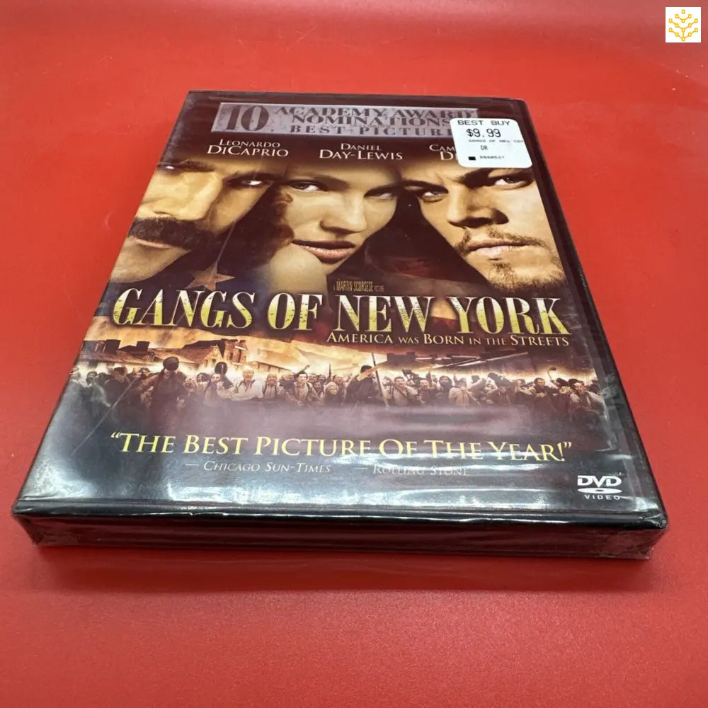 DVD copy of the movie ’Gangs of New York’ on a red surface.