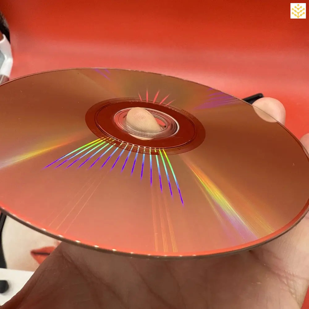 Compact disc (CD) reflecting rainbow colors across its metallic surface.