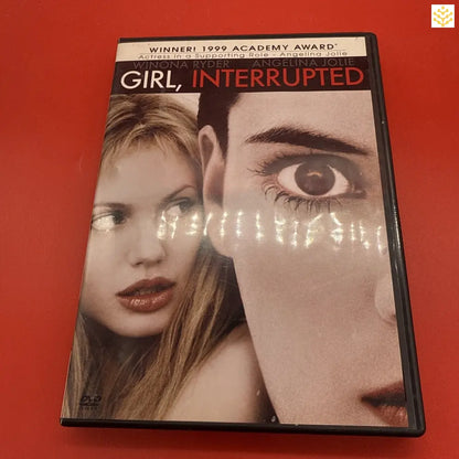 DVD case of the 1999 film ’Girl, Interrupted’ featuring a split-face artistic cover design.