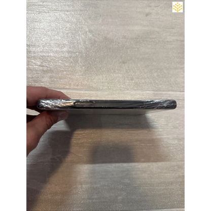 Damaged smartphone with a severely bent and cracked screen.