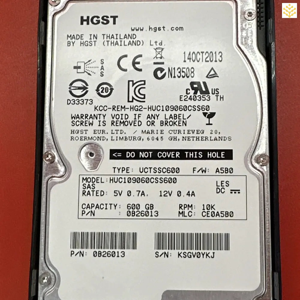 Hard disk drive with technical specifications and labels visible on its casing.