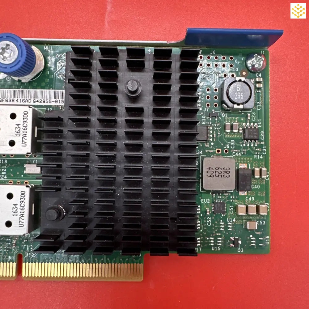 Computer network interface card with a prominent black heat sink.