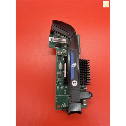 Computer graphics card or video card component with visible circuit board and cooling element.