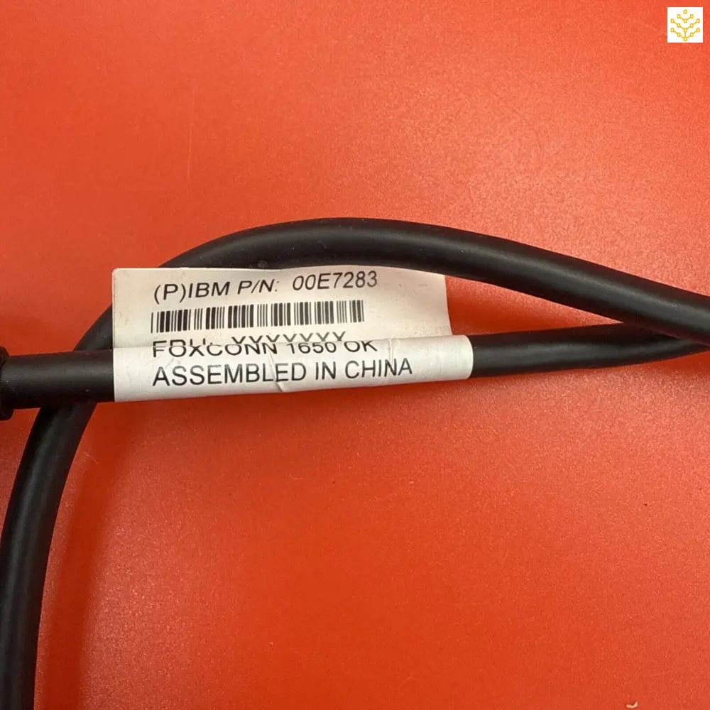 Black cable with a white label showing IBM part number and manufacturing information.