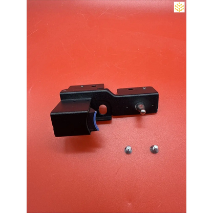 Black metal mounting bracket with two detached screws.