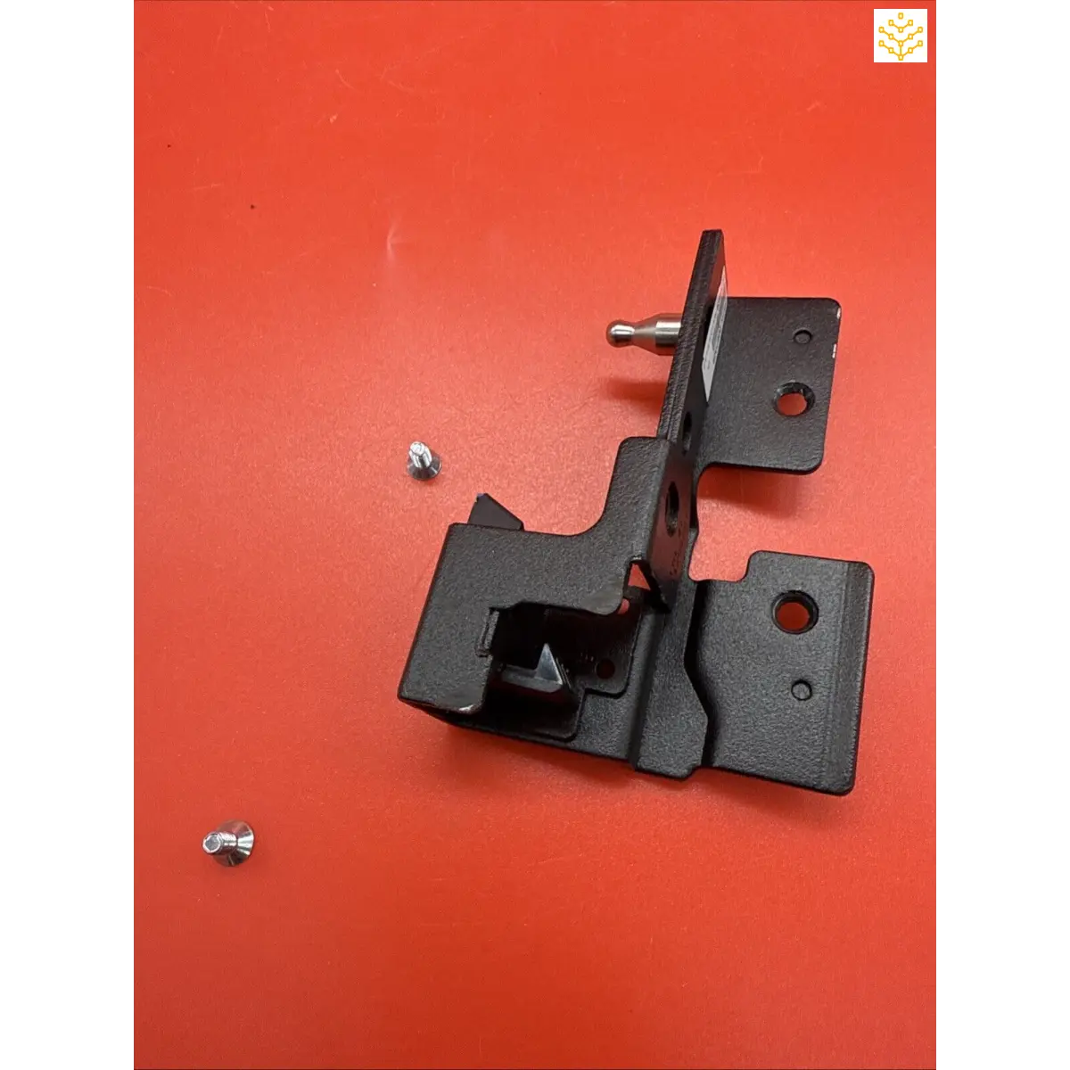 Black metal mounting bracket with multiple holes and angles.