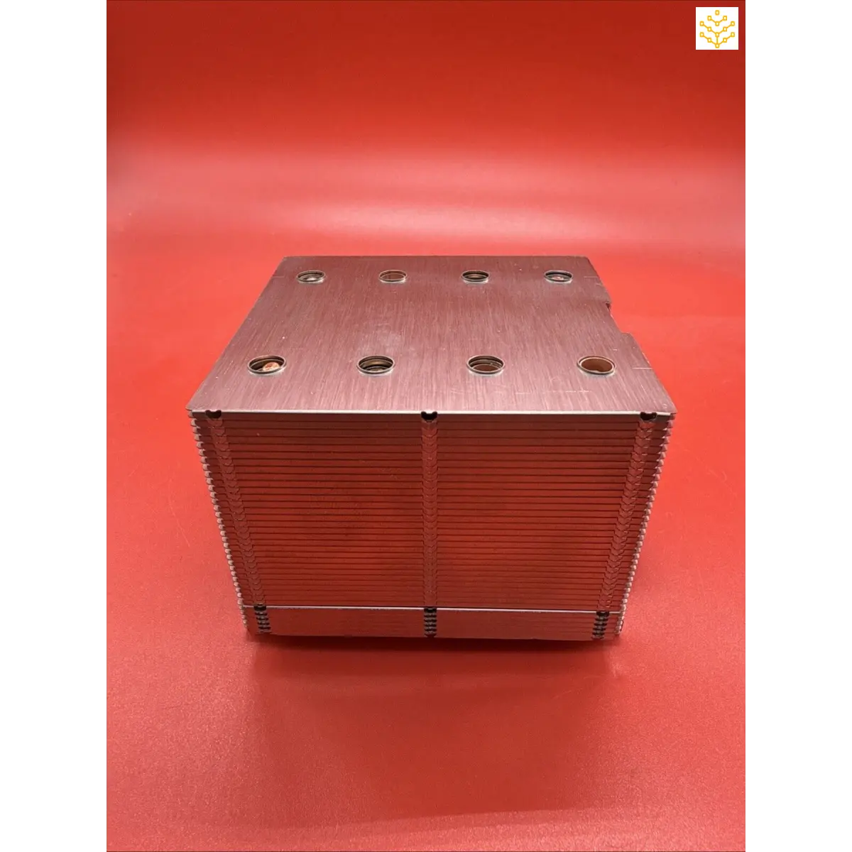 Stack of metal plates with mounting holes arranged in a rectangular block formation.